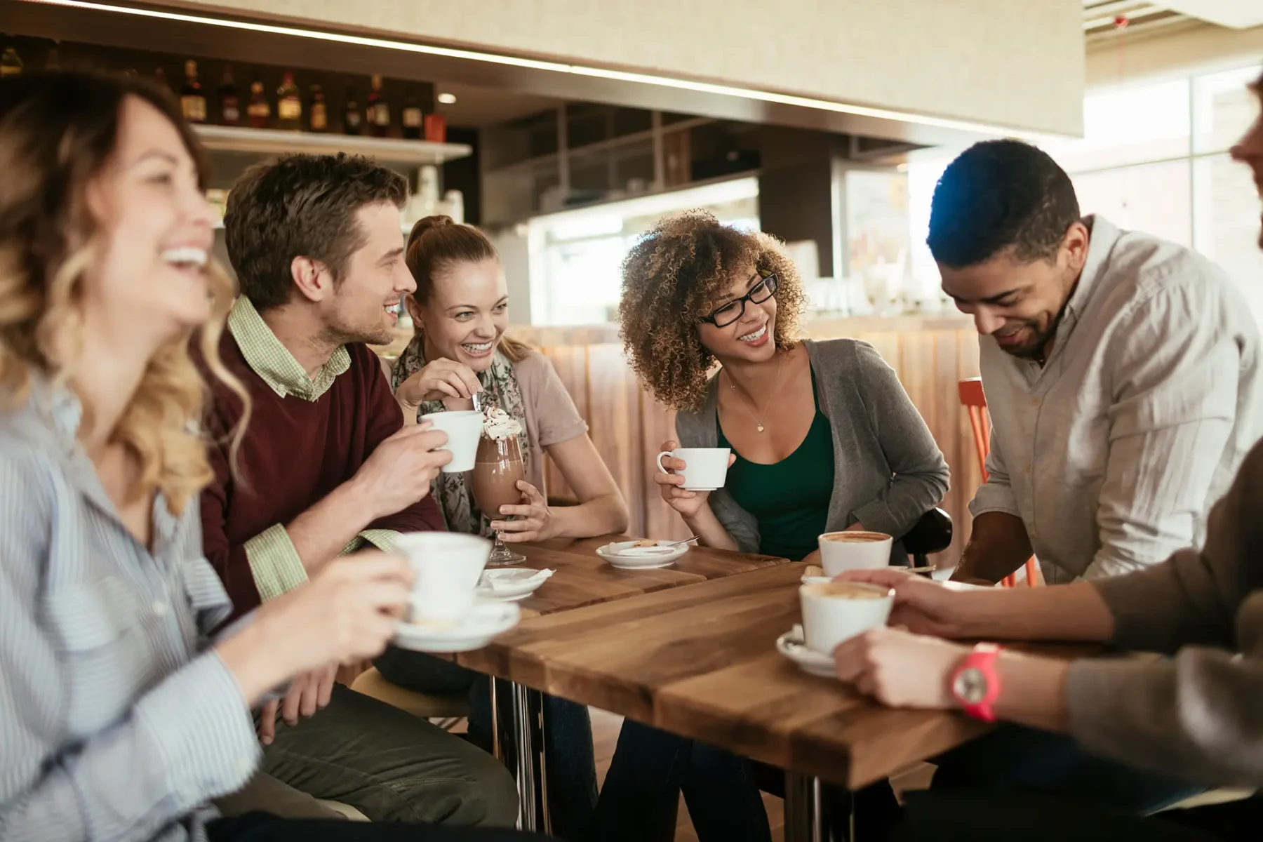 Group of friends hanging out in a cafe