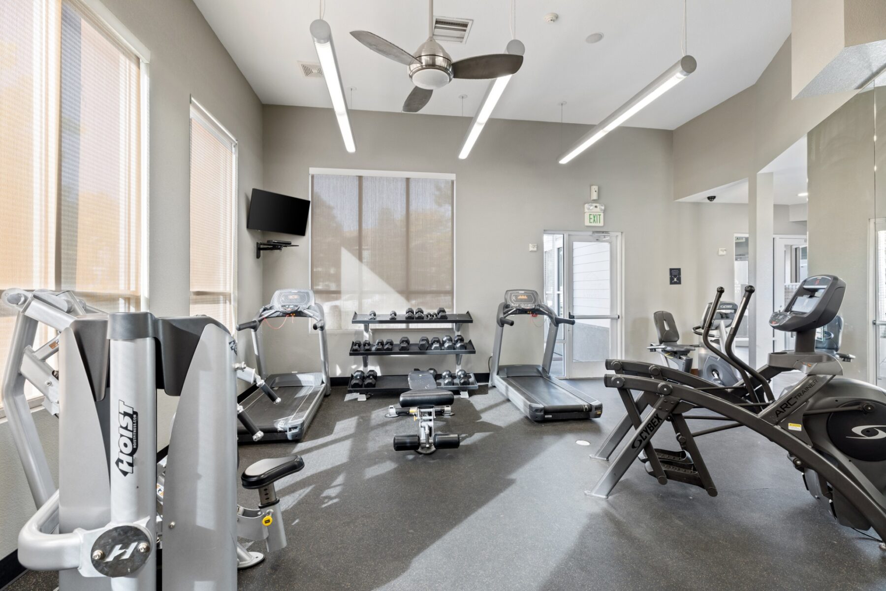 Fitness center with strength training equipment and cardio machines