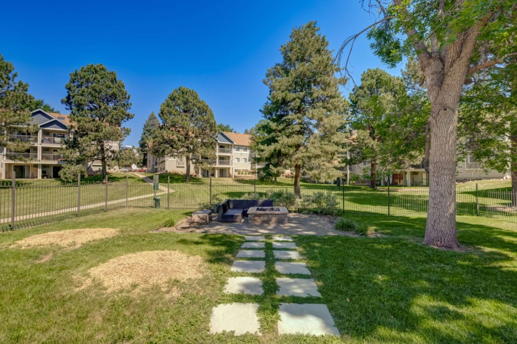 Exterior with lots of green space between buildings and large trees